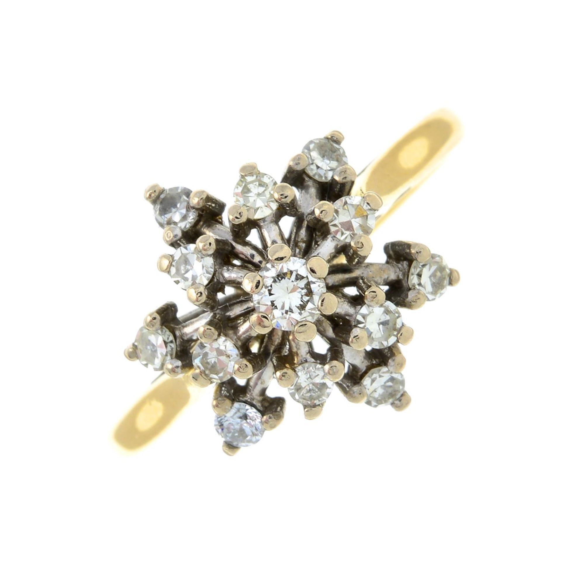 An 18ct gold brilliant-cut diamond star cluster ring.Estimated total diamond weight 0.40ct.