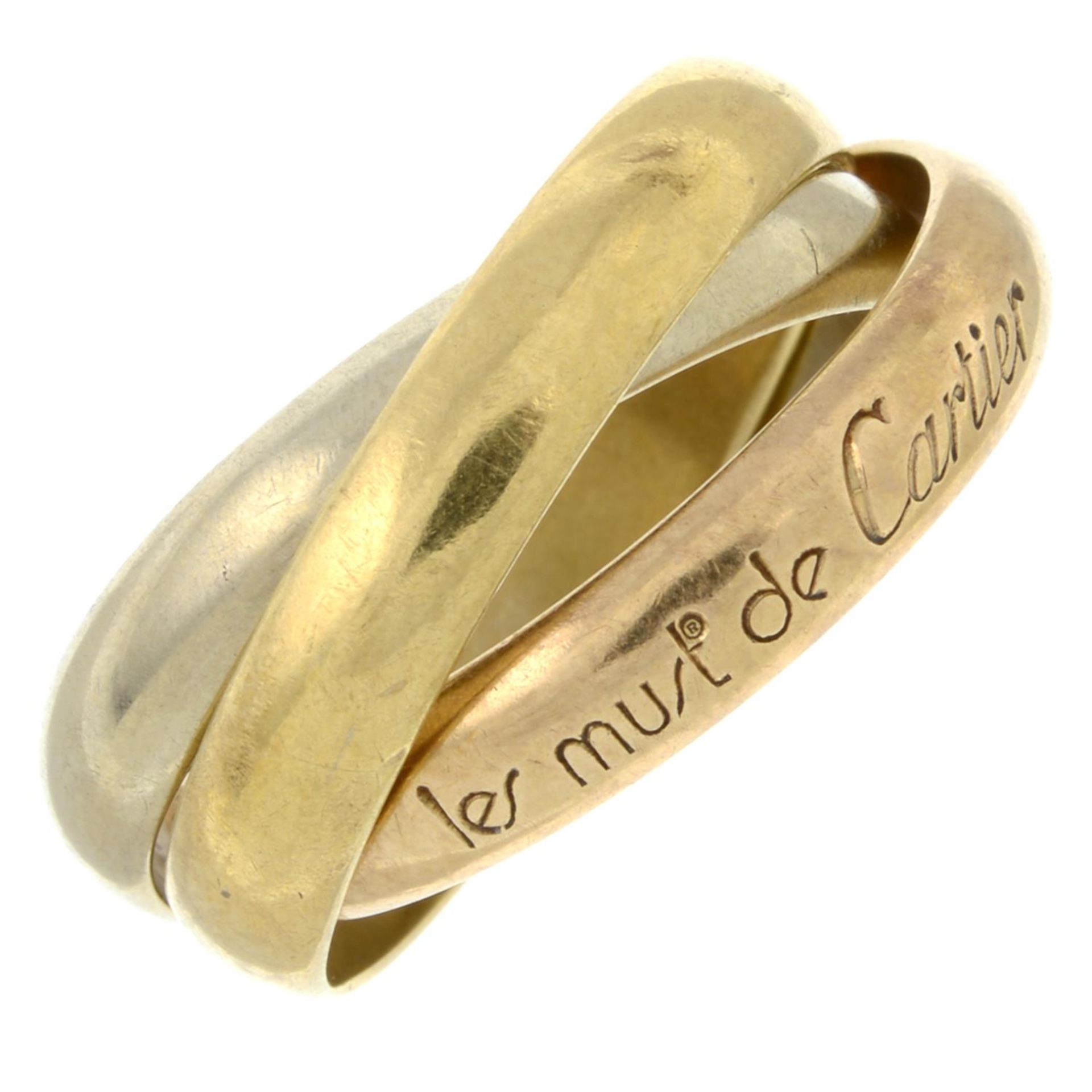 A 'Les Must de Cartier Trinity' ring, by Cartier.Maker's marks for Cartier.