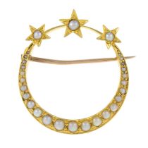 A late 19th century 15ct gold split pearl star and crescent brooch.Length 2.8cms.