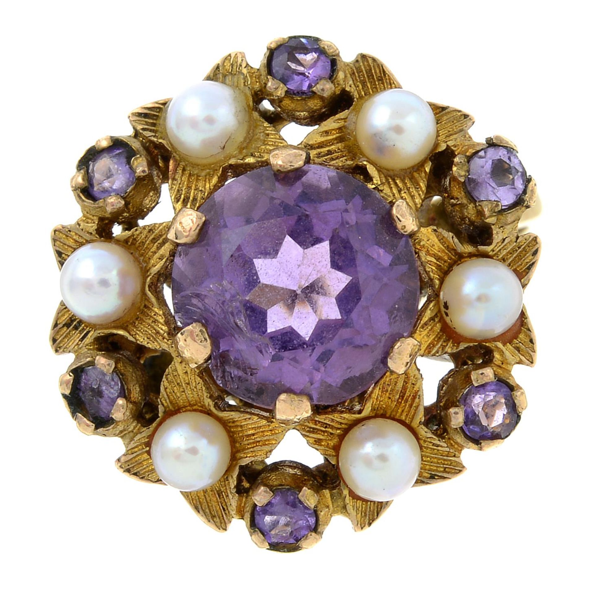 A 1960s 9ct gold amethyst and cultured pearl cluster ring.Hallmarks for London, 1965.