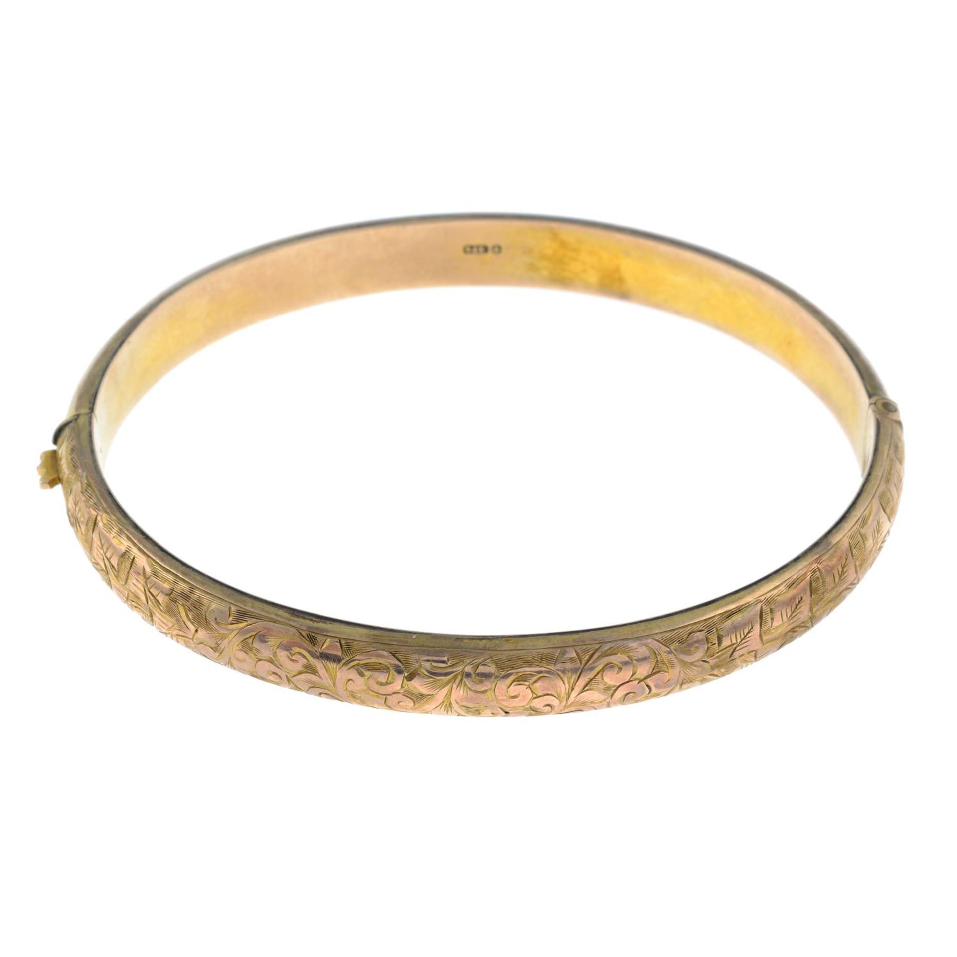 An early 20th century 9ct gold engraved bangle.Hallmarks for Chester, 1903.