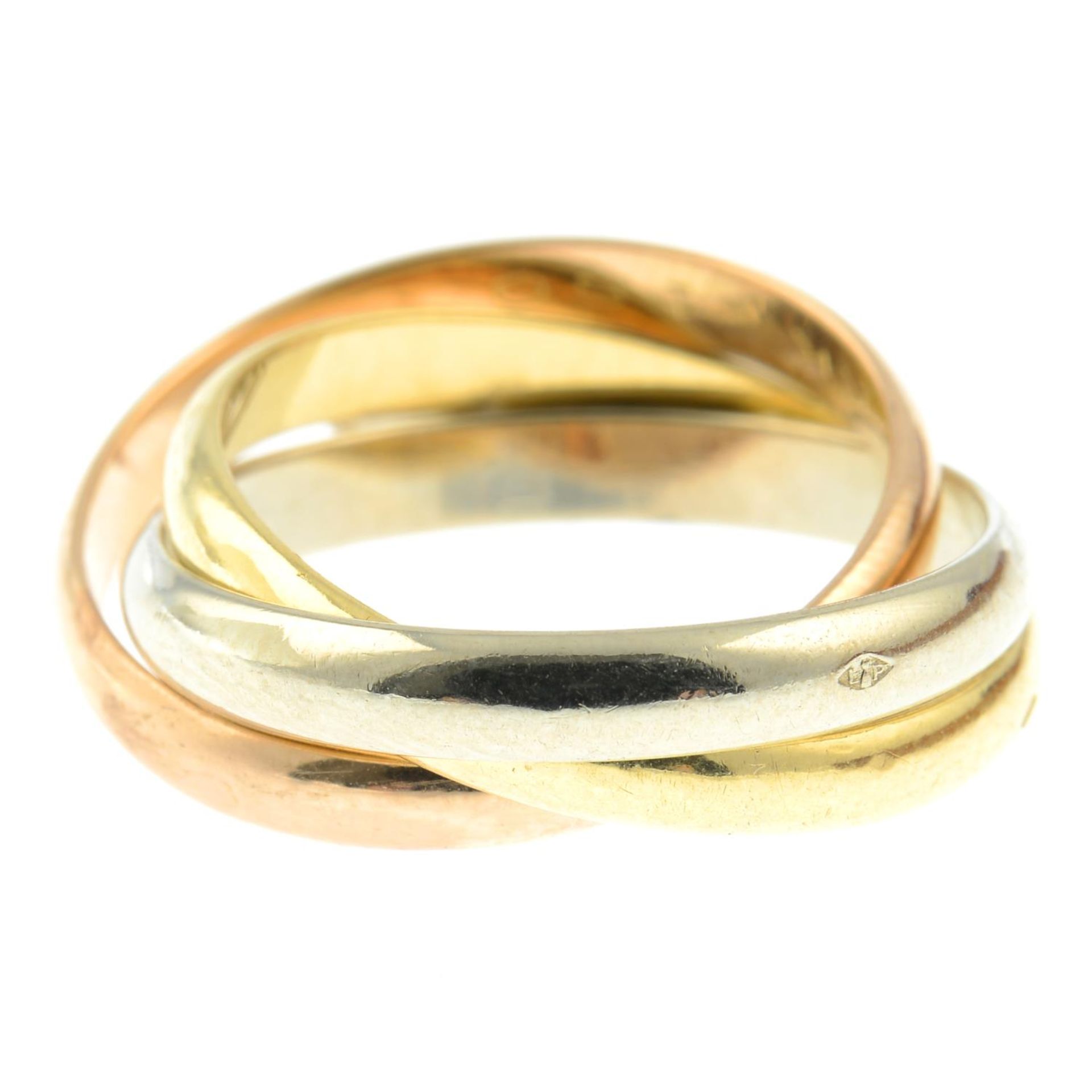 A 'Trinity' tri-colour ring, by Cartier.Signed Cartier, KK160. - Bild 2 aus 3