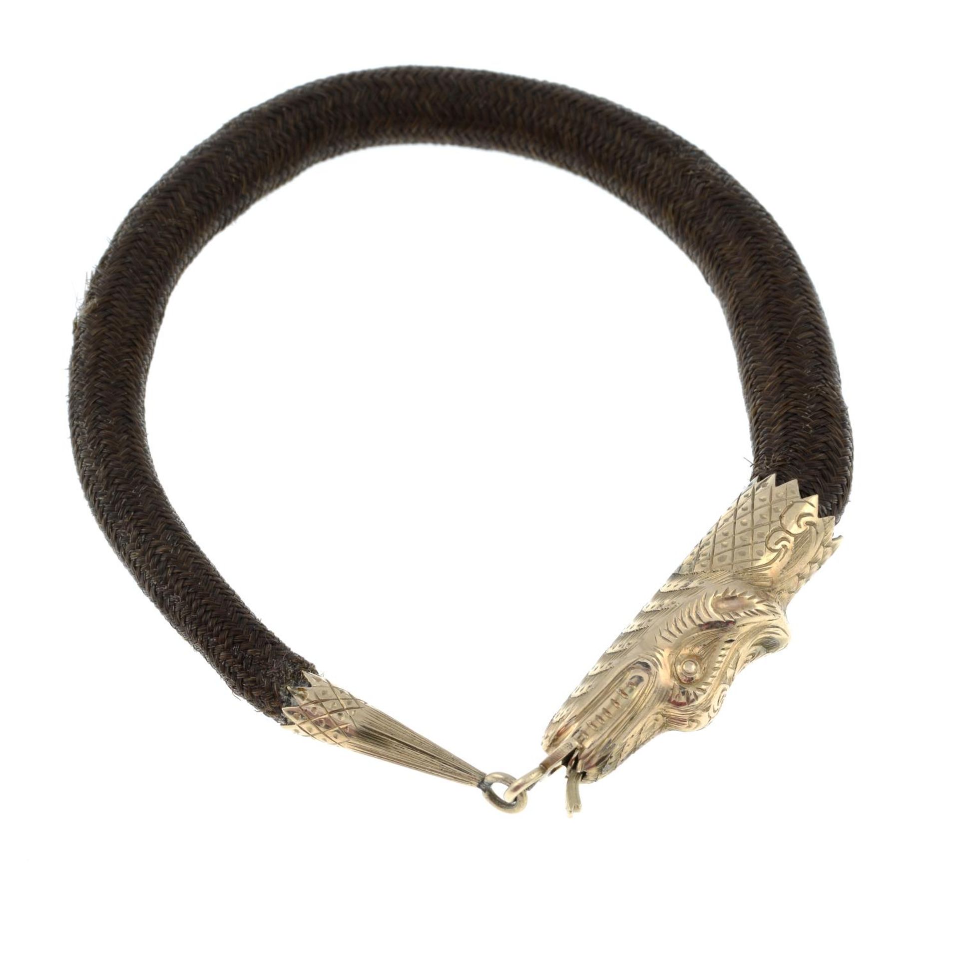 A late Victorian gold woven hairwork memorial bracelet, designed to depict a snake.Length 17.5cms. - Bild 3 aus 3