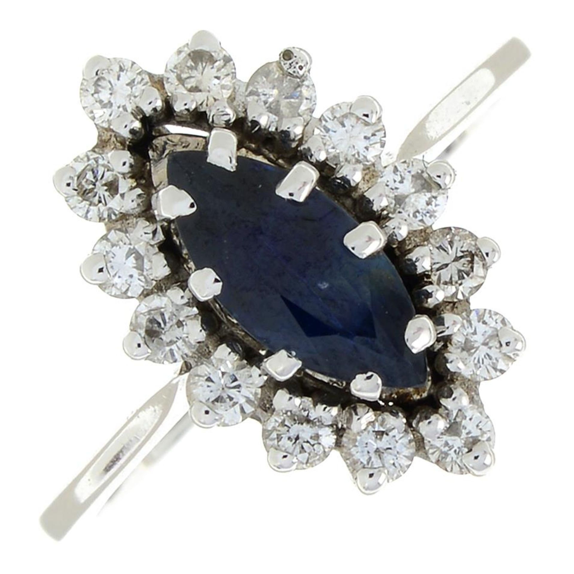 A sapphire and brilliant-cut diamond cluster ring.Estimated total diamond weight 0.40ct.Ring size