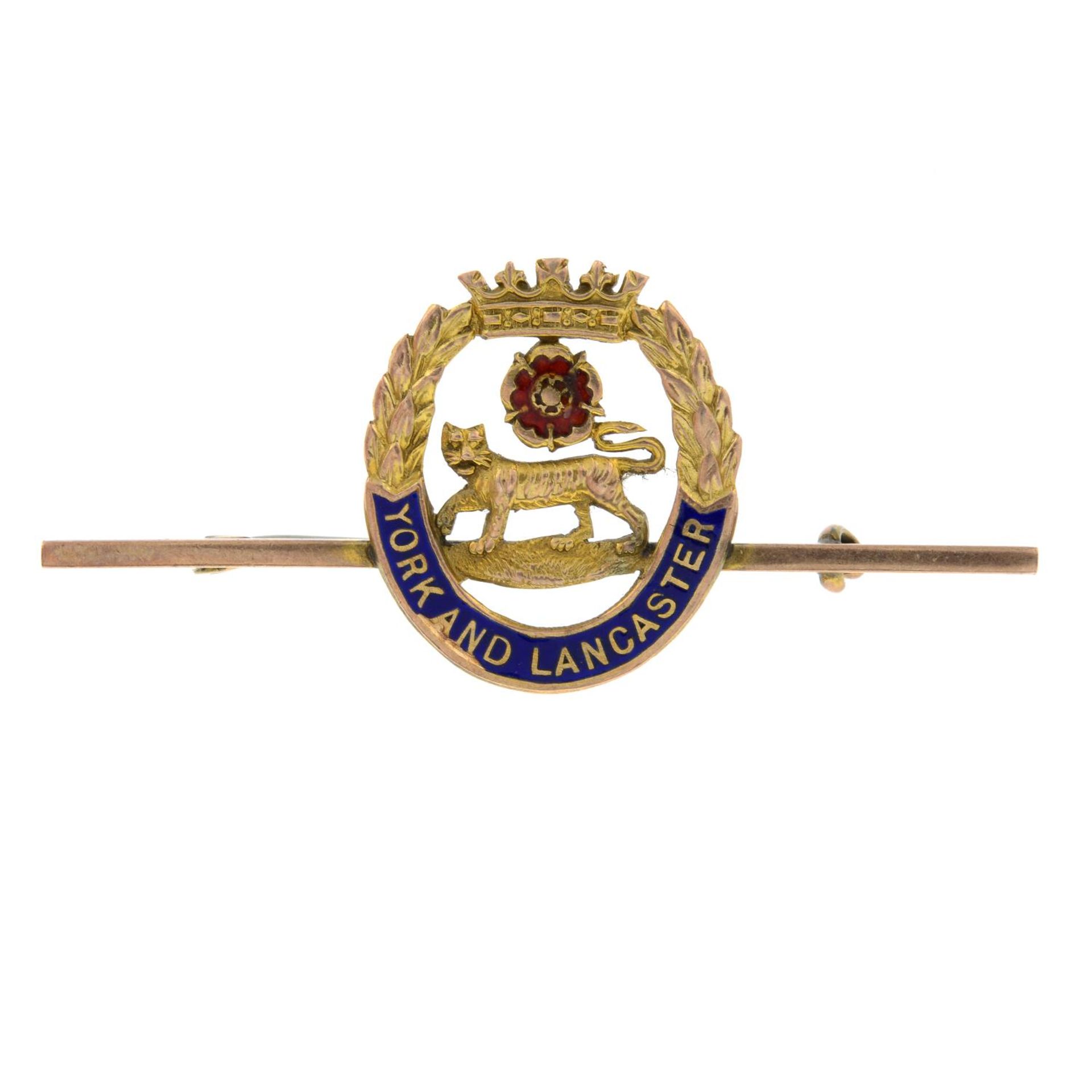 An early 20th century 9ct gold and enamel 'The York and Lancaster Regiment' brooch.Stamped 9CT.