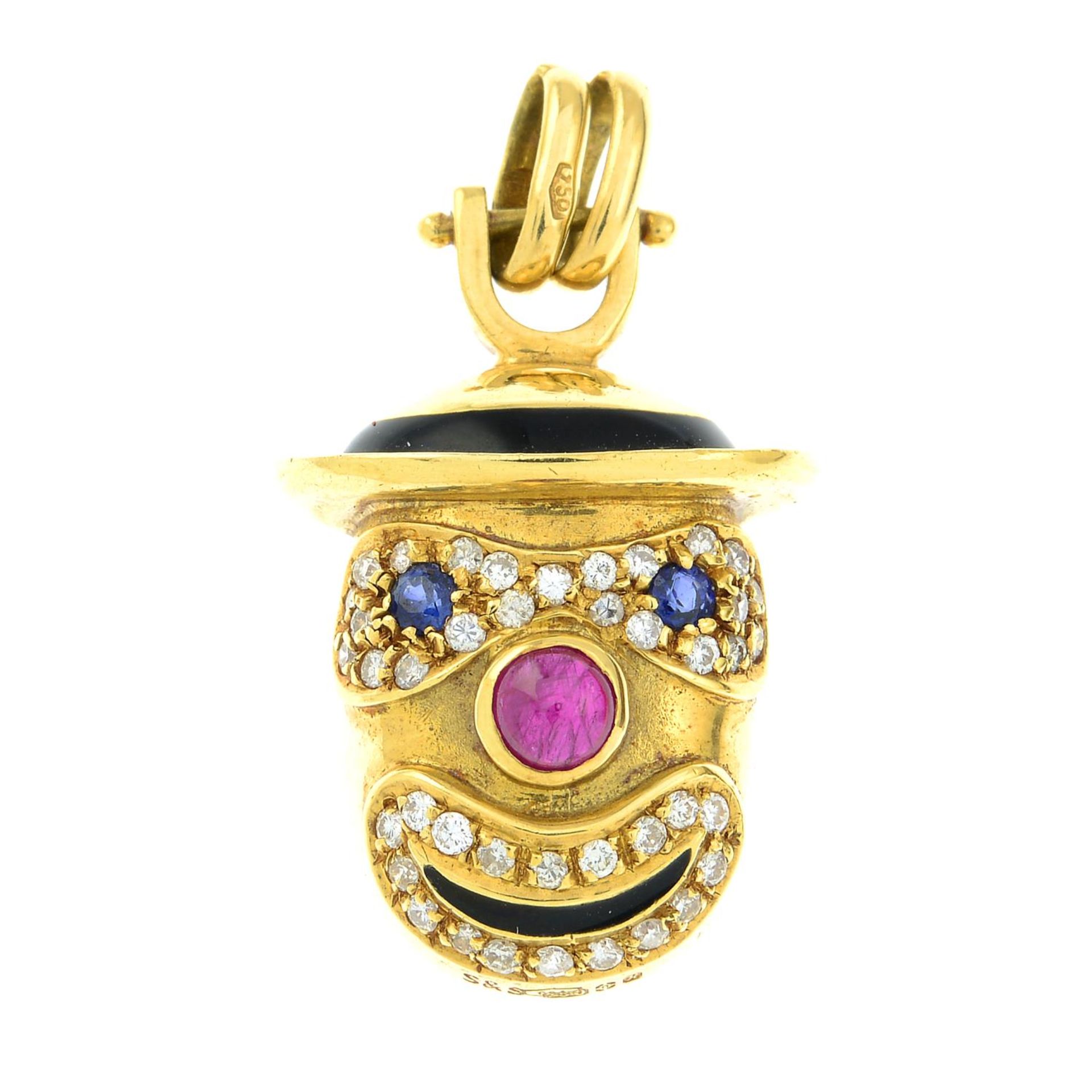 An 18ct gold diamond, ruby and sapphire clown face pendant.Estimated total diamond weight 0.40ct.