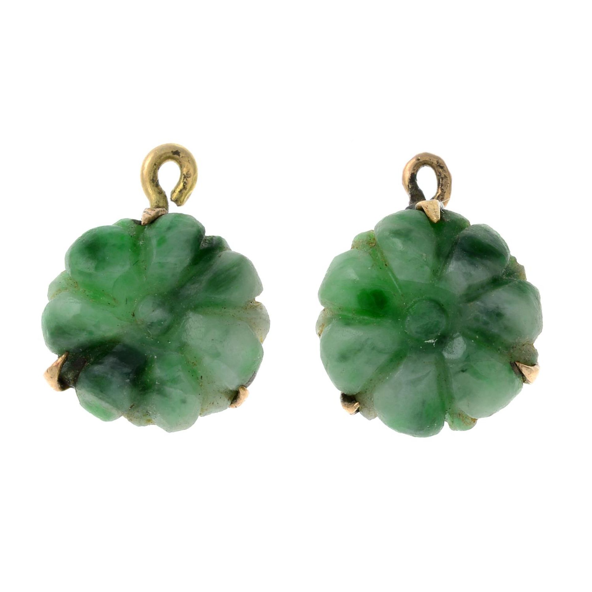 A pair of carved nephrite floral stud earrings.Length 1.5cms.