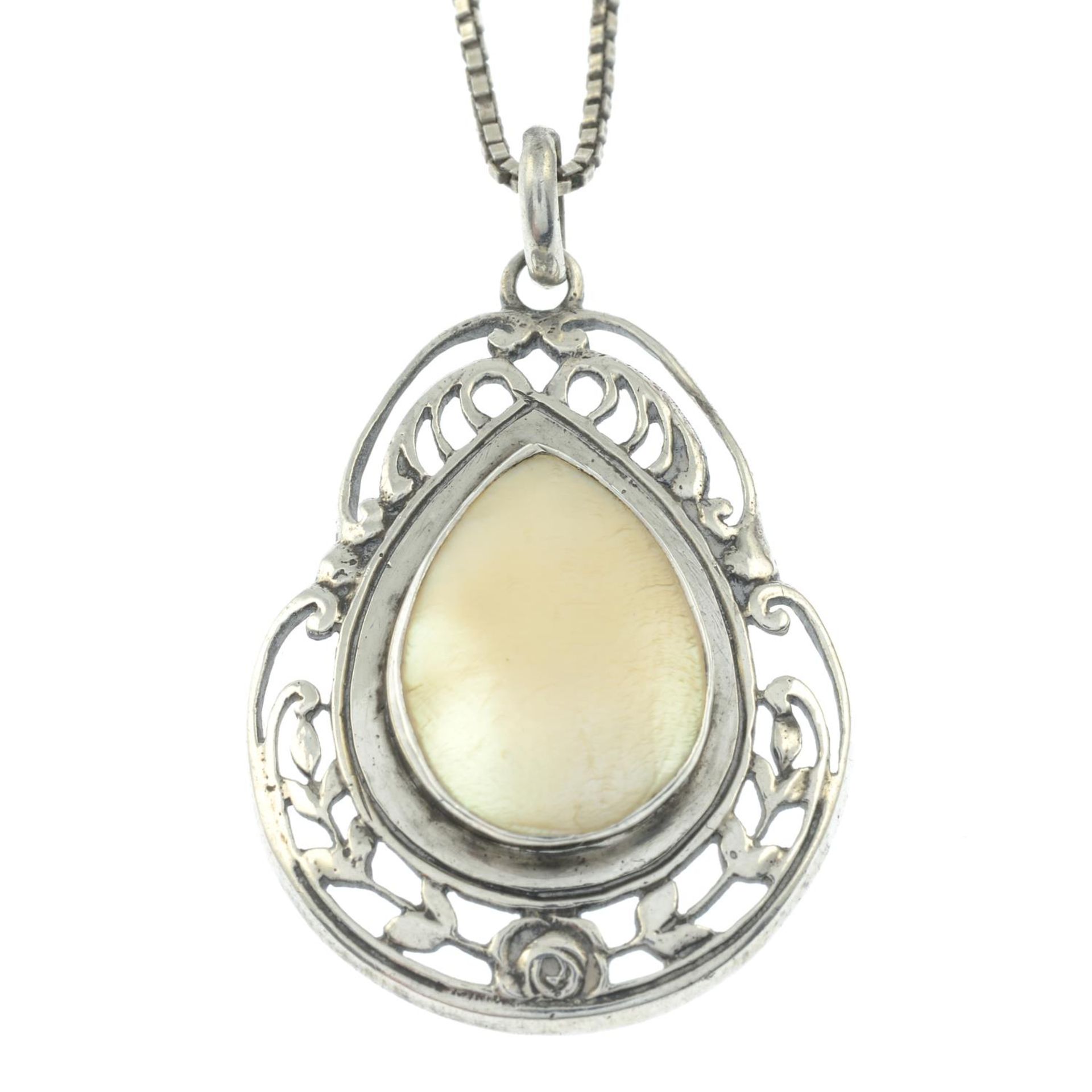 An Arts and Crafts silver mother-of-pearl pendant,