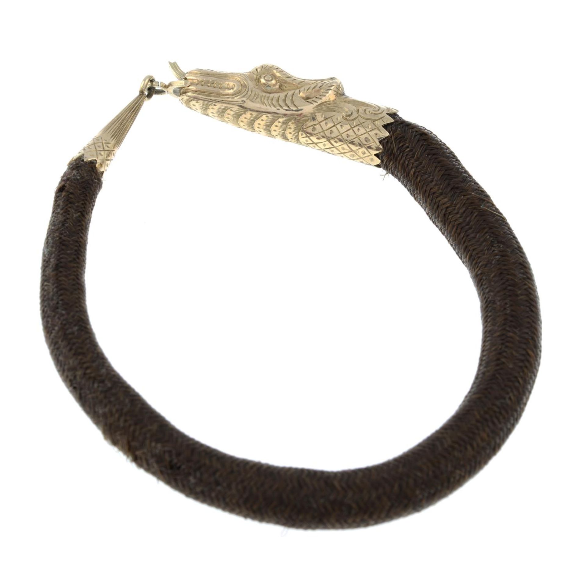 A late Victorian gold woven hairwork memorial bracelet, designed to depict a snake.Length 17.5cms. - Bild 2 aus 3