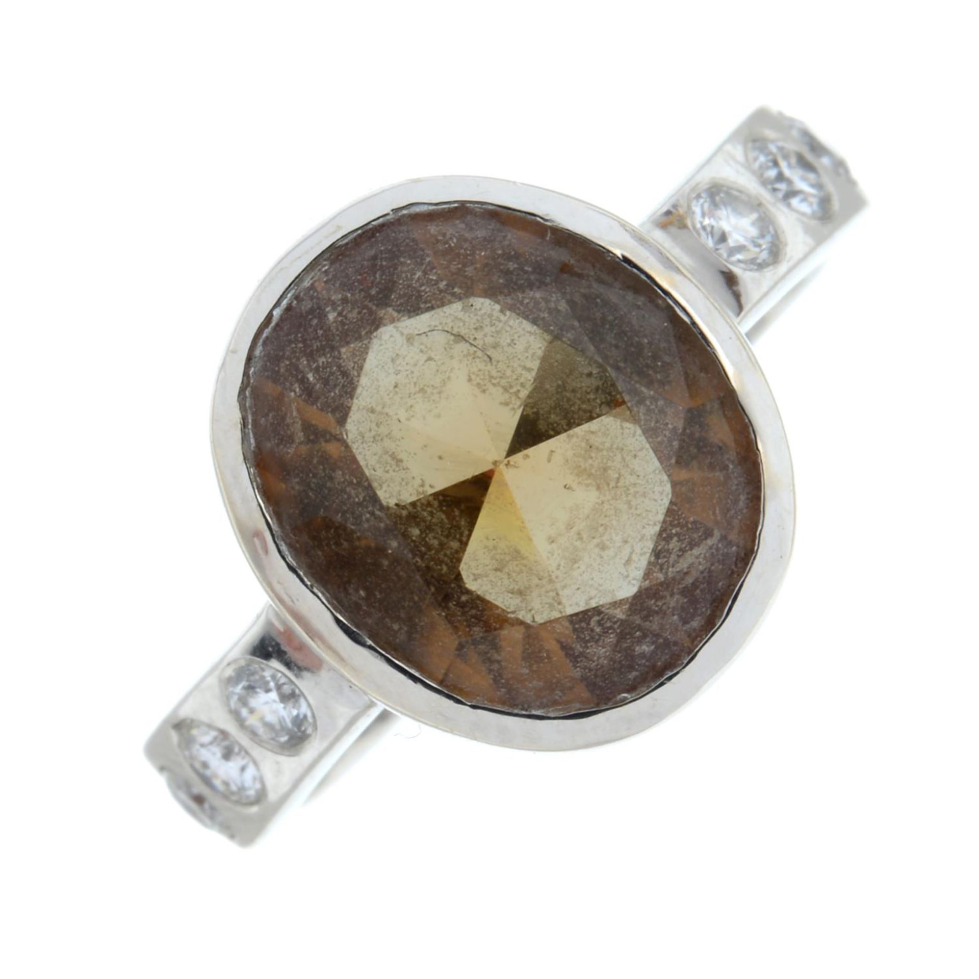 A colour-change zultanite and brilliant-cut diamond ring.Zultanite calculated weight 4cts,