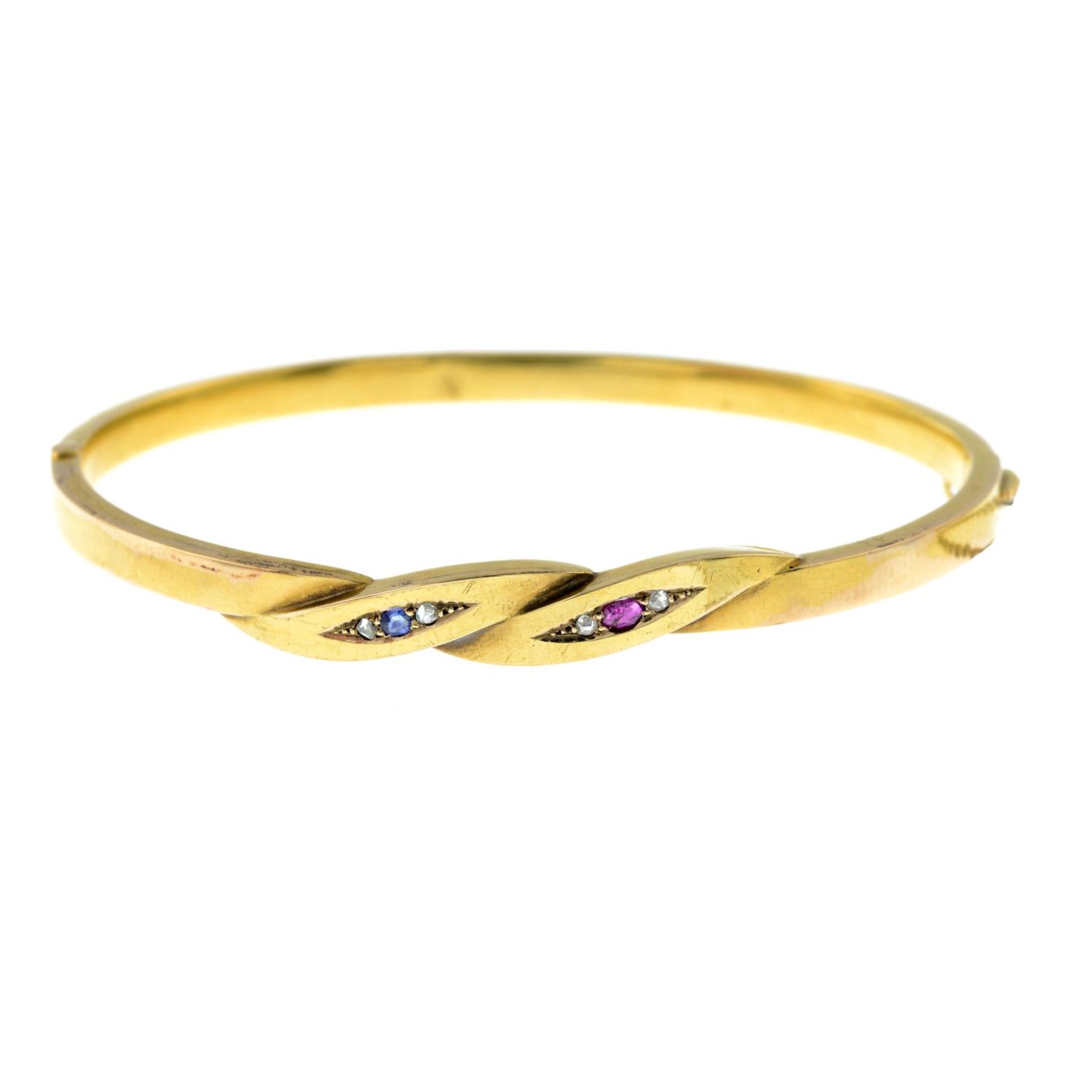 An early 20th century 18ct gold bangle,