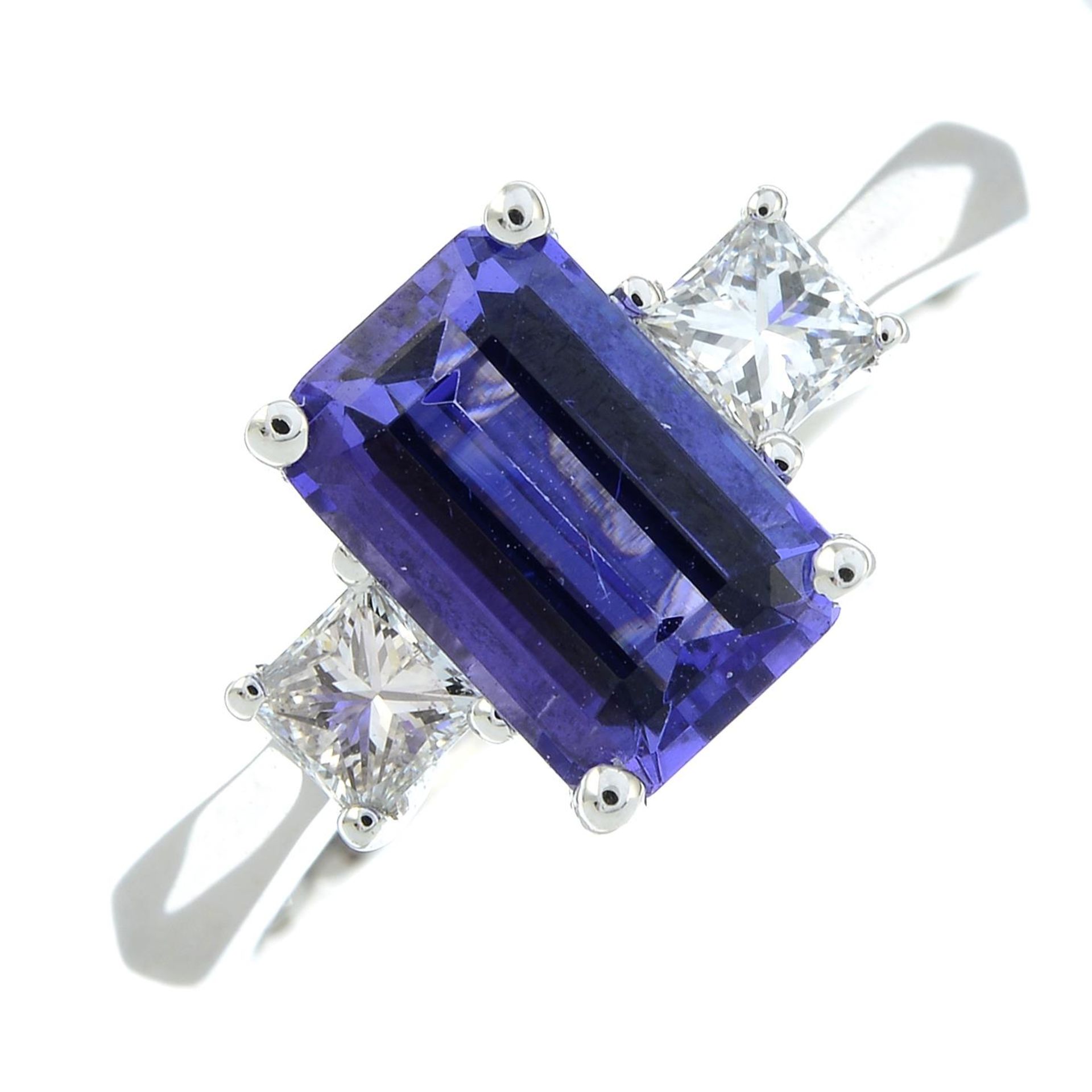 An 18ct gold tanzanite and square-shape diamond three-stone ring.Tanzanite calculated weight