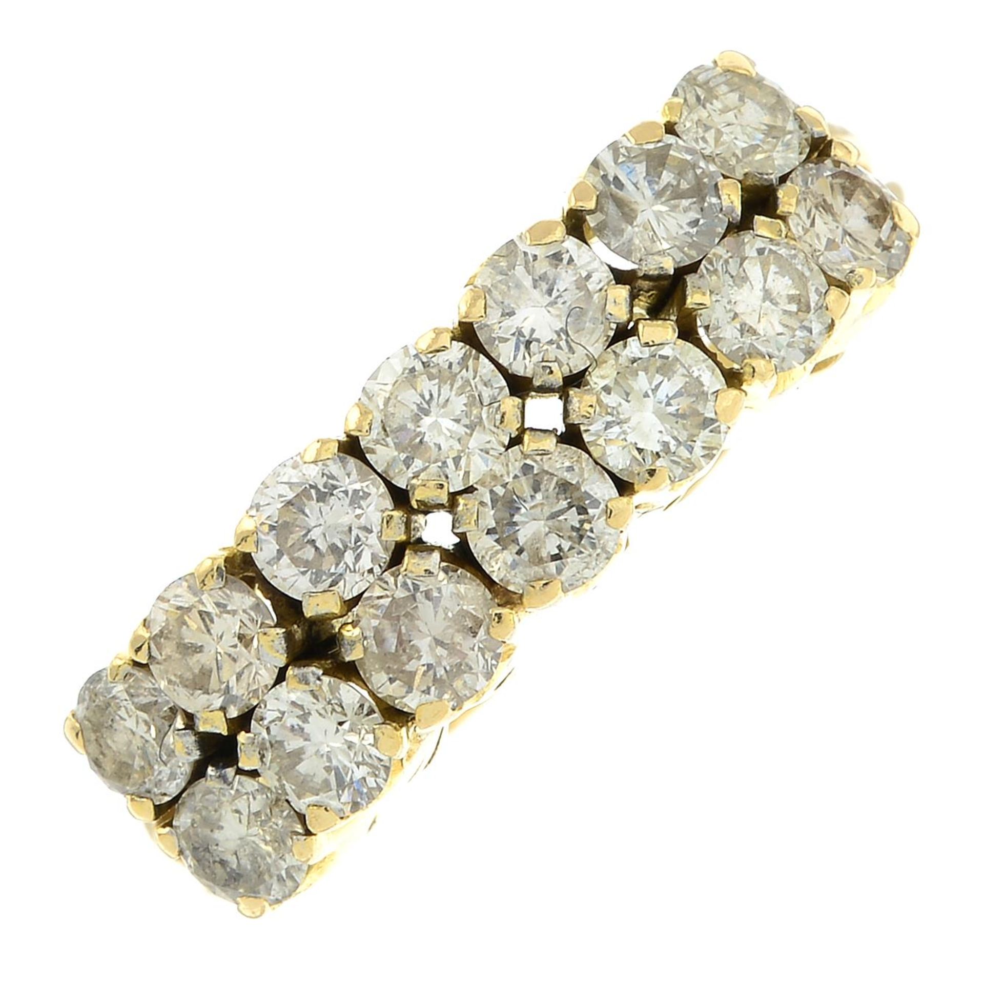 An 18ct gold brilliant-cut diamond two-row ring.Estimated total diamond weight 1.40cts,