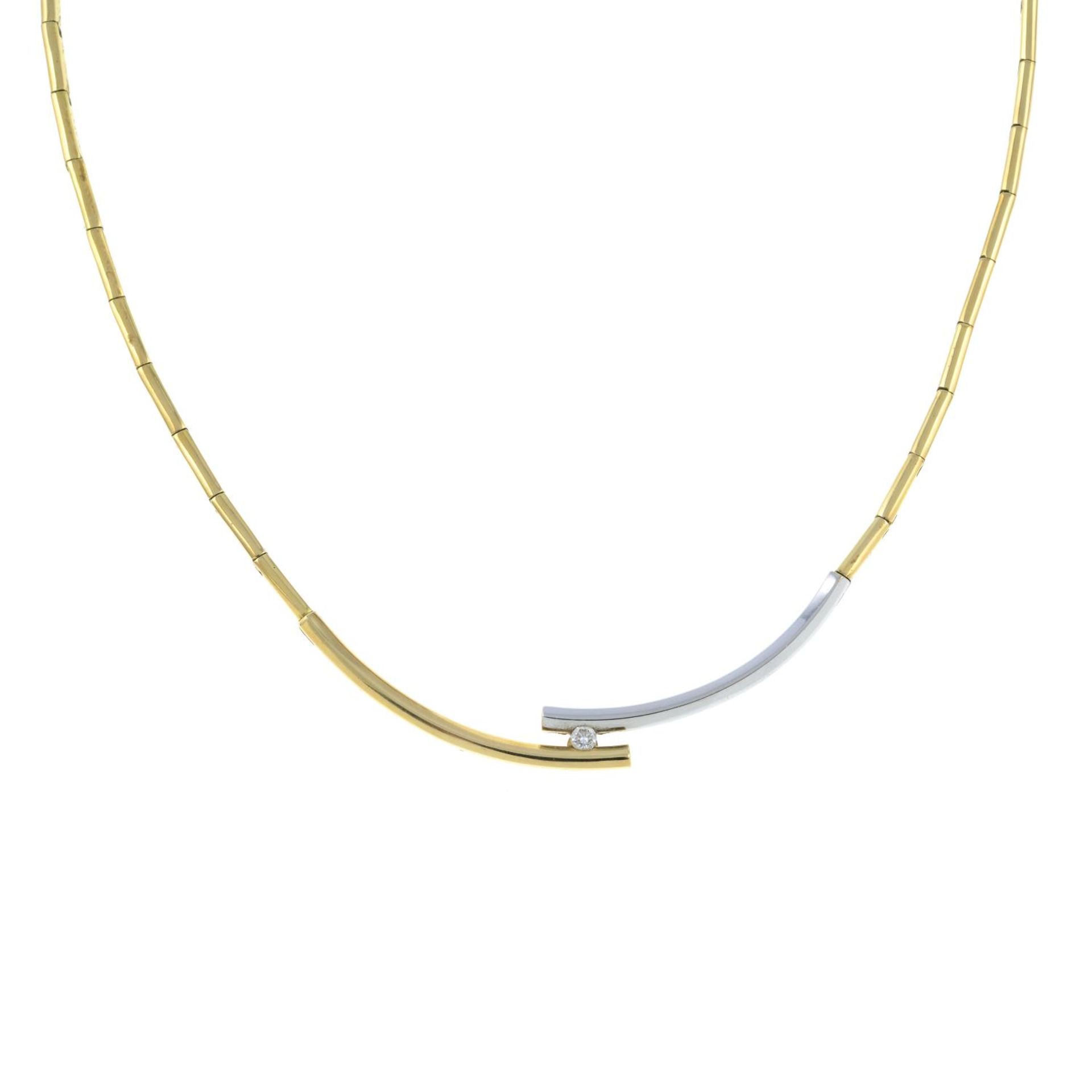 A brilliant-cut diamond bi-colour necklace.Stamped 585.Length 40.2cms.