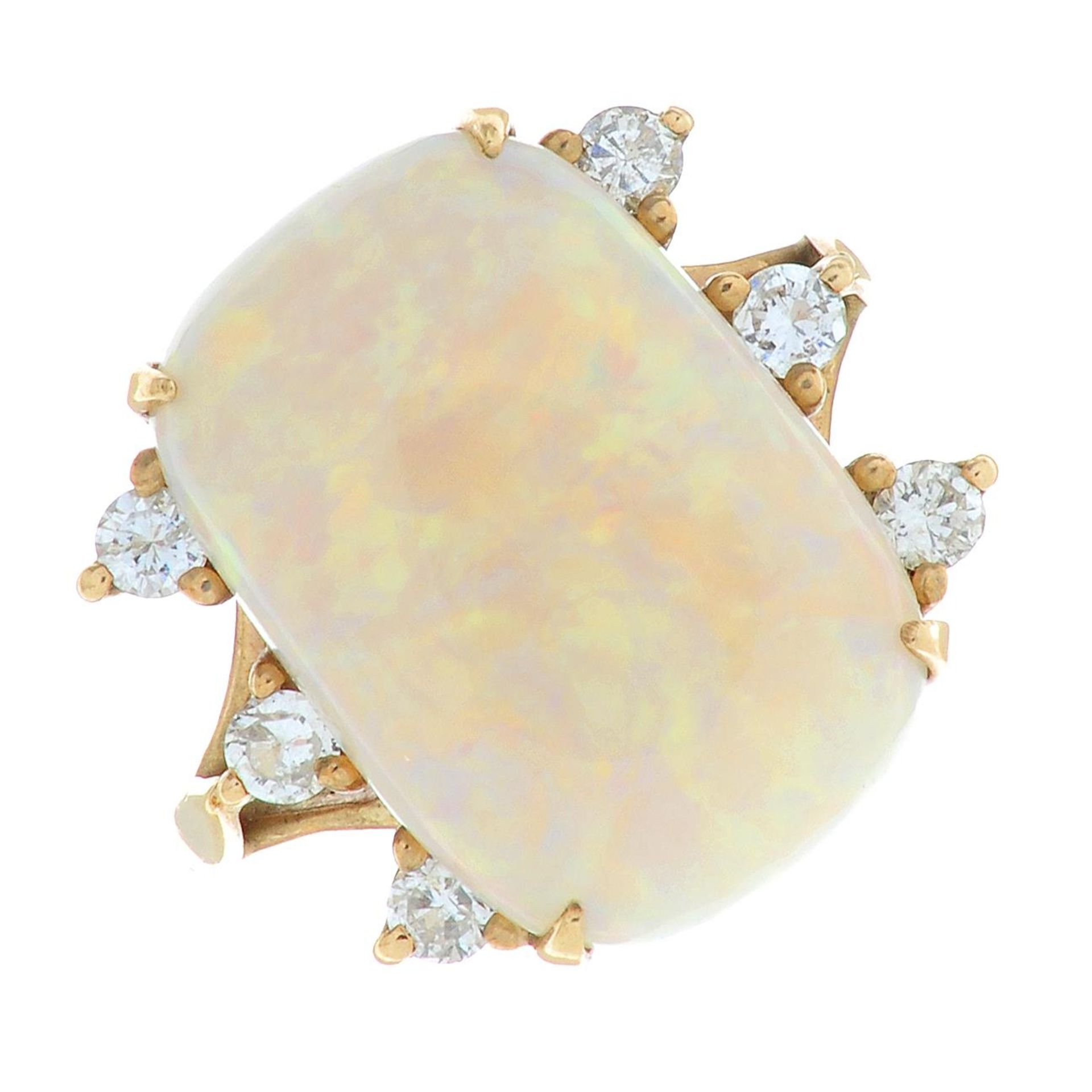 A 9ct gold opal and brilliant-cut diamond dress ring.Estimated opal dimensions 17.2 by 11.8 by