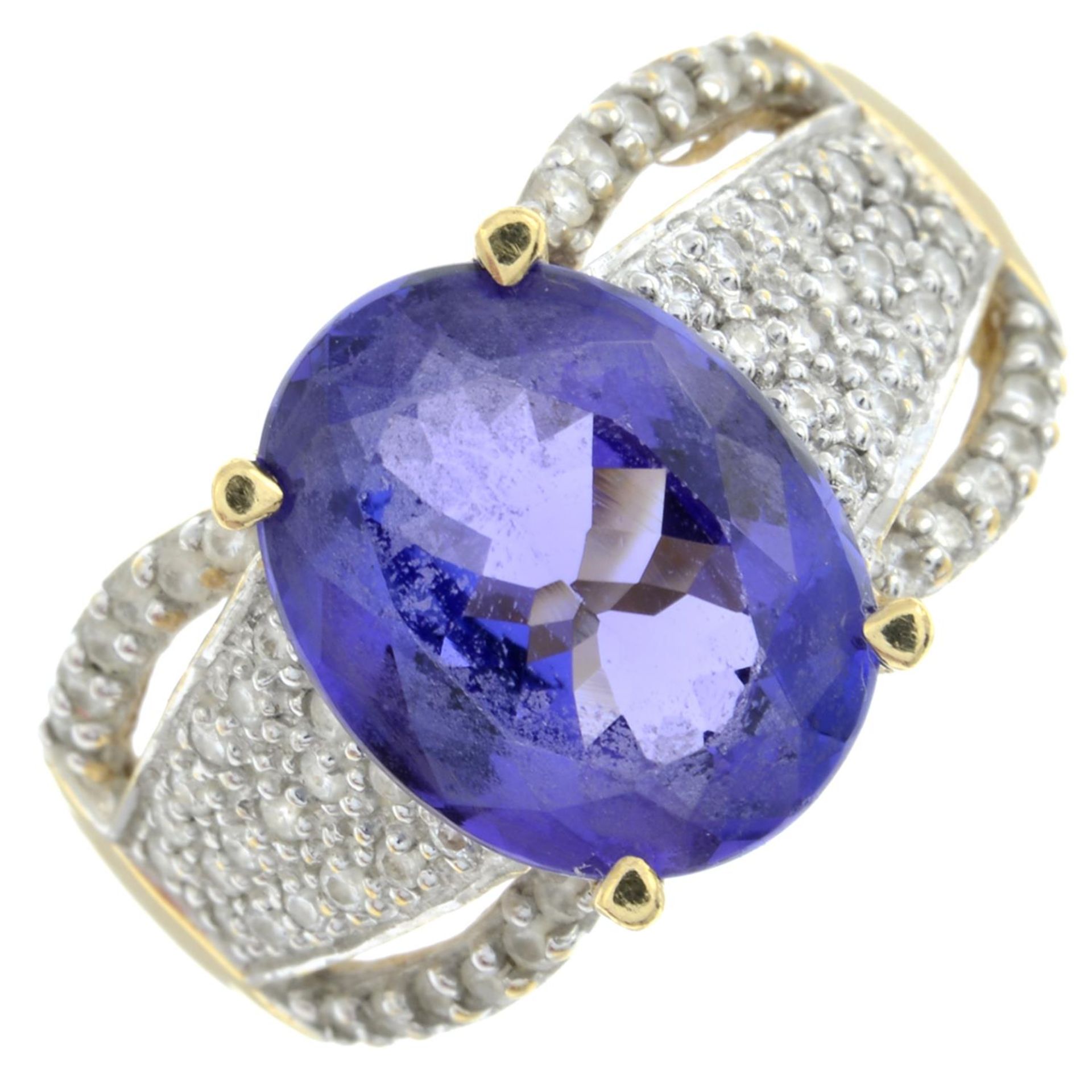 An 18ct gold tanzanite and brilliant-cut diamond dress ring.Tanzanite calculated weight 4.17cts,