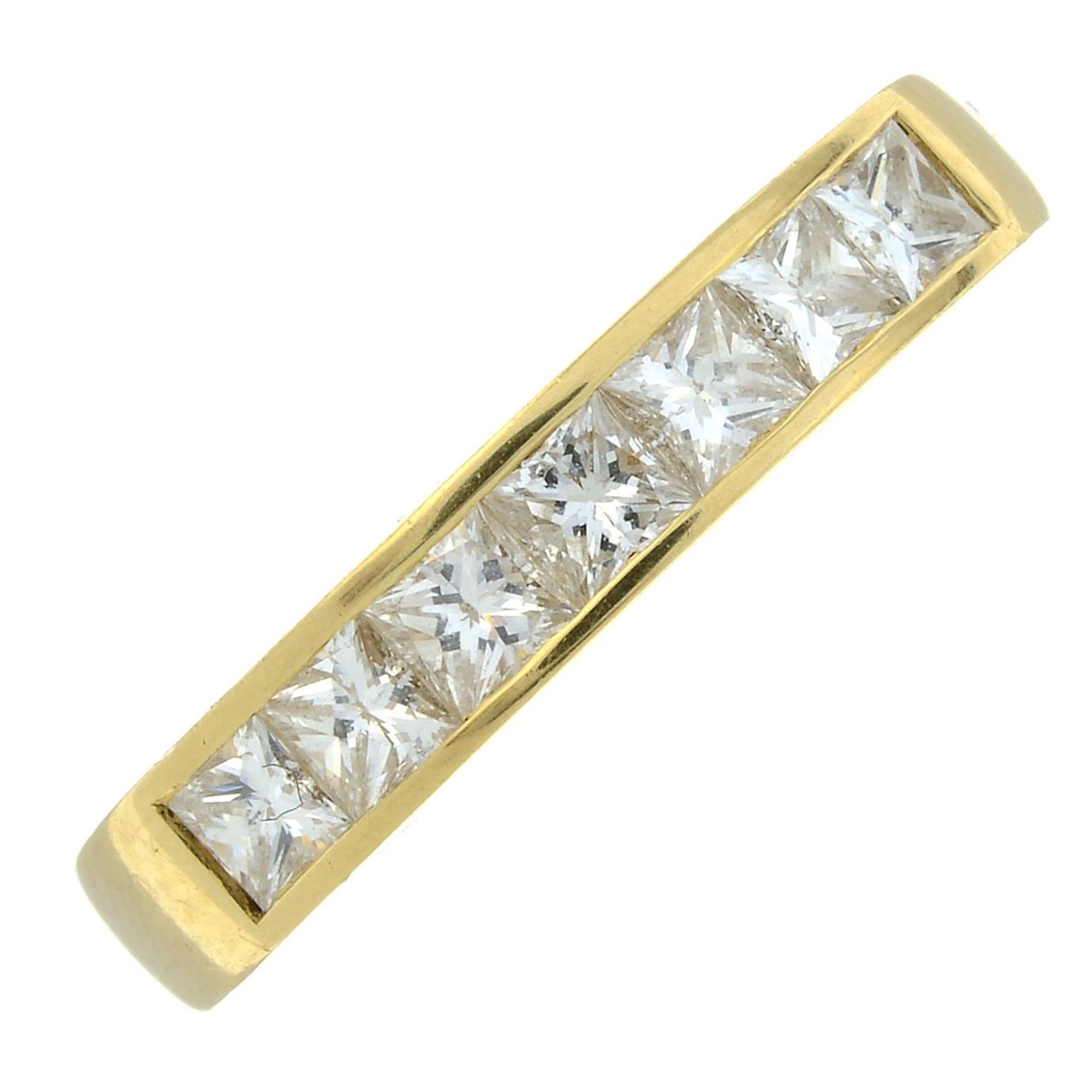 An 18ct gold square-shape diamond half eternity ring.Estimated total diamond weight 0.70ct,