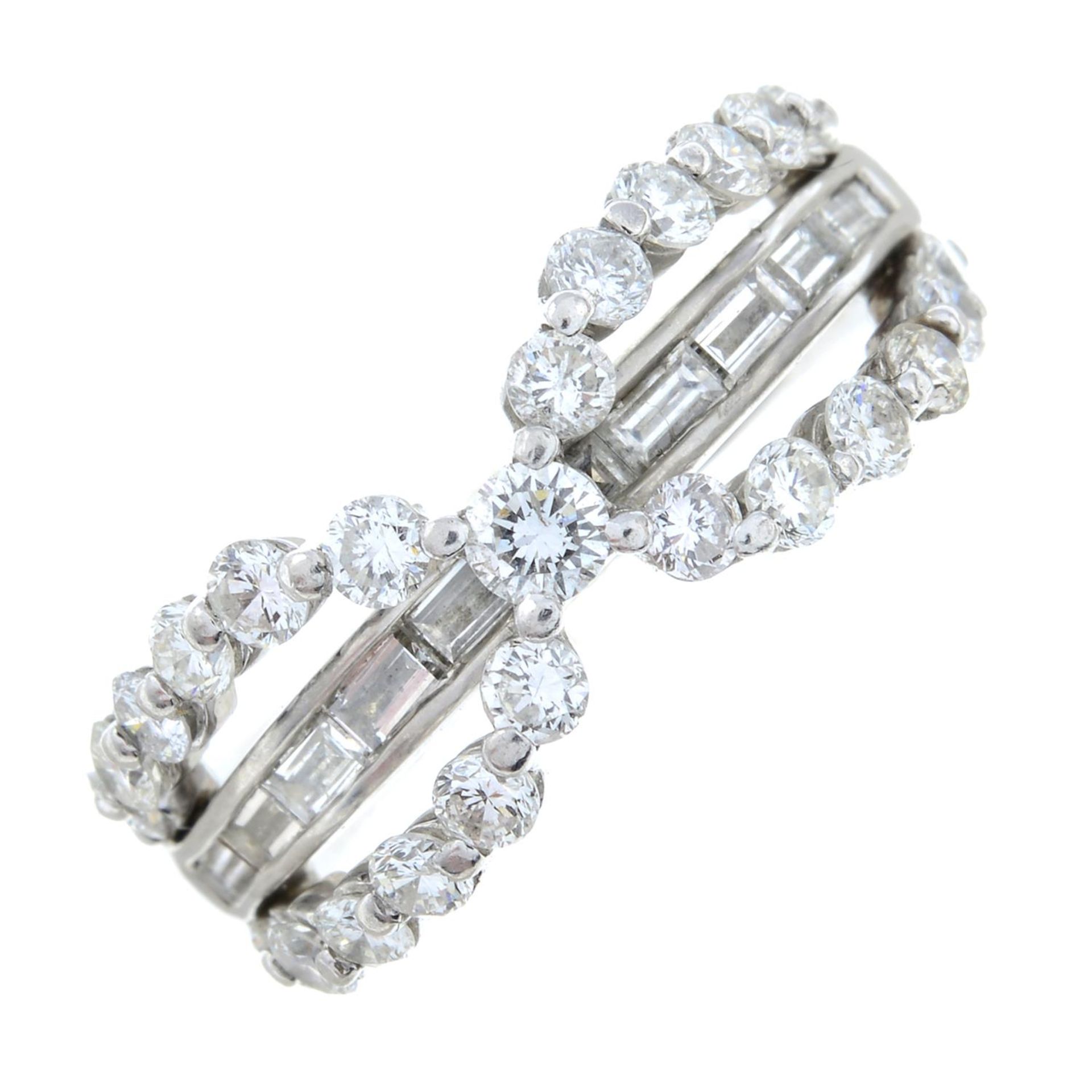 An 18ct gold brilliant and baguette-cut diamond openwork dress ring.Total diamond weight 1.53cts,