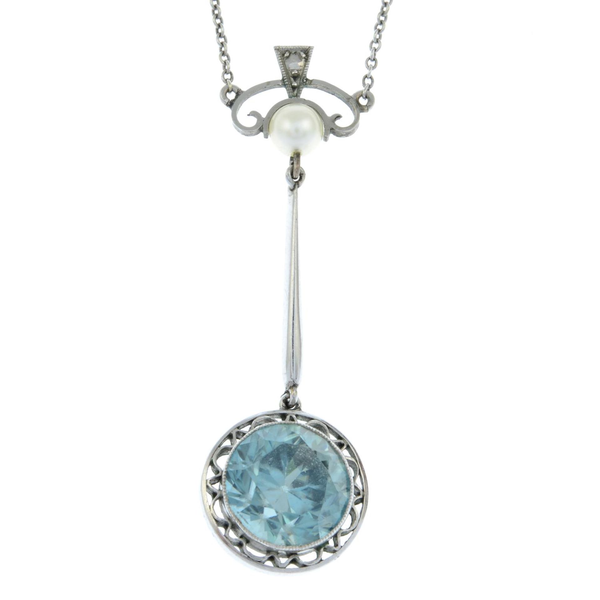 An early 20th century 9ct gold blue zircon and cultured pearl pendant,