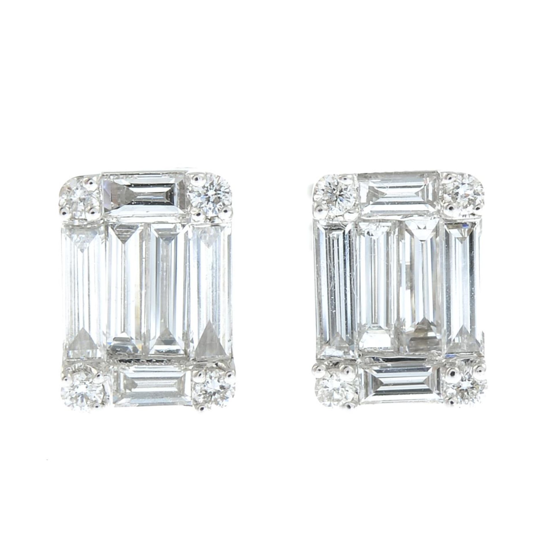 A pair of vari-cut diamond cluster earrings.Total diamond weight 0.54ct.