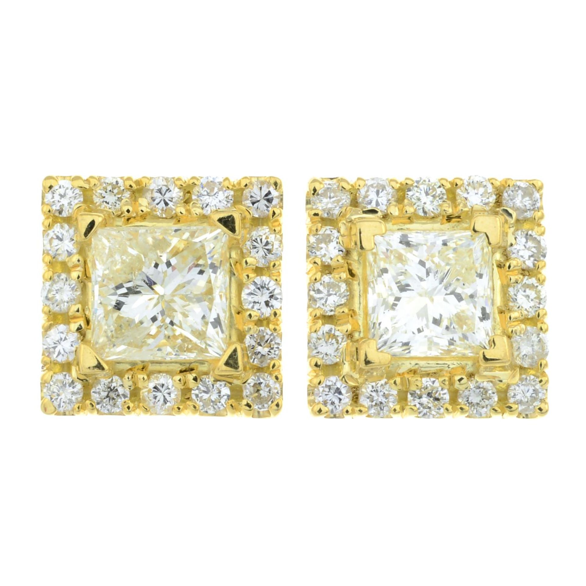 A pair of square-shape and brilliant-cut diamond cluster earrings.