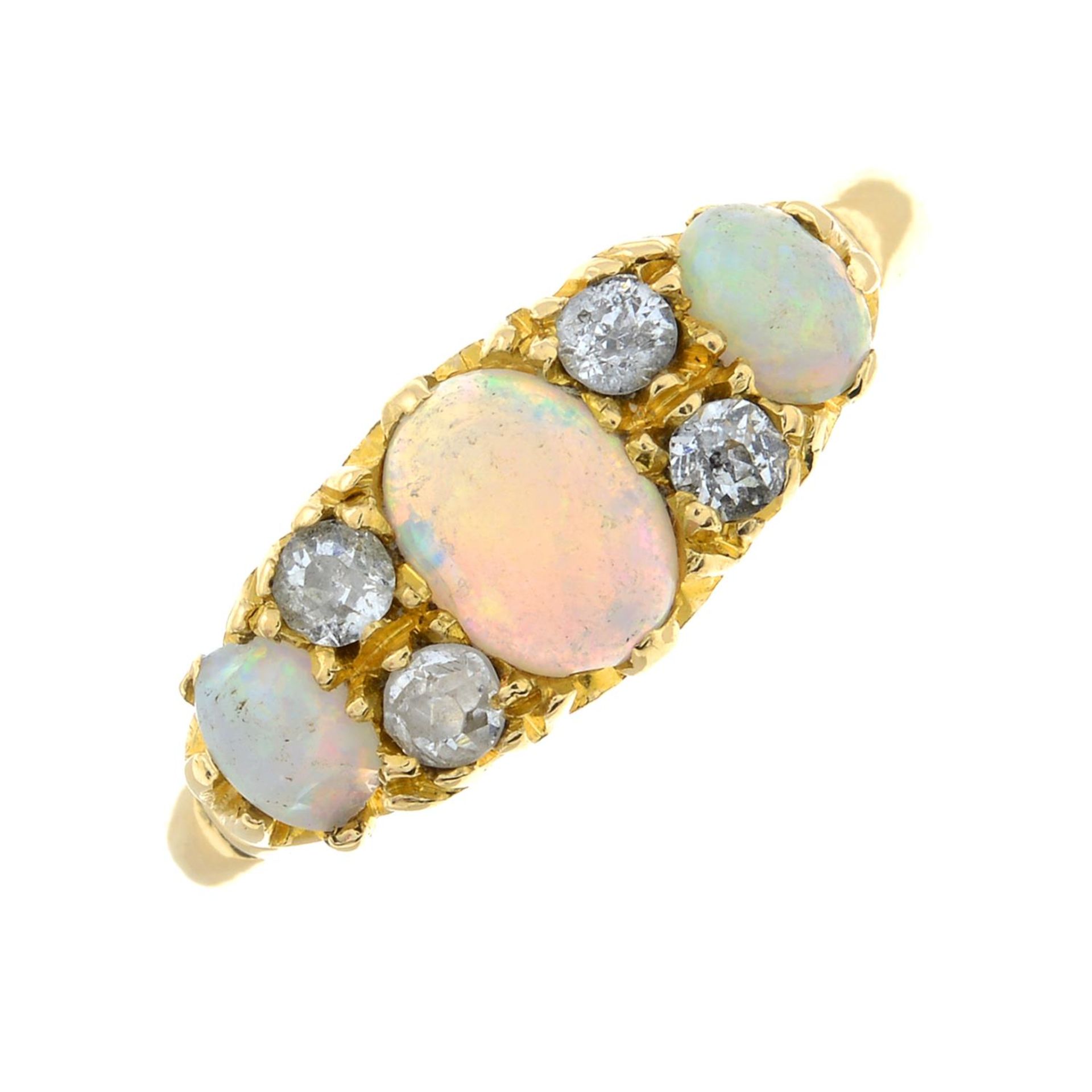 An Edwardian 18ct gold opal cabochon and old-cut diamond dress ring.Estimated total diamond weight