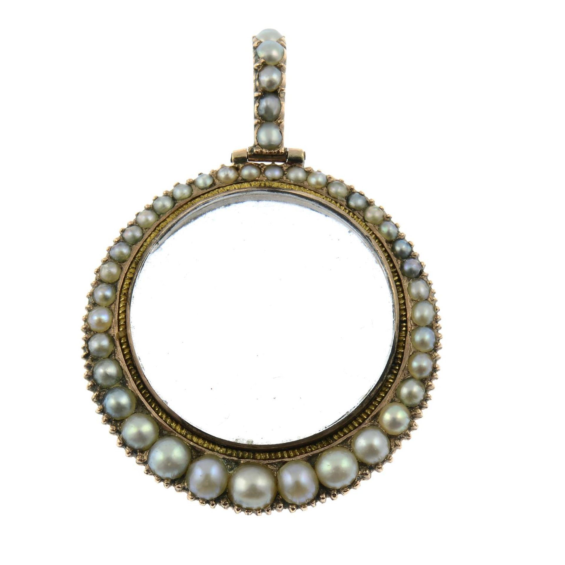 An early 20th century gold split pearl locket pendant.Length 3.8cms.