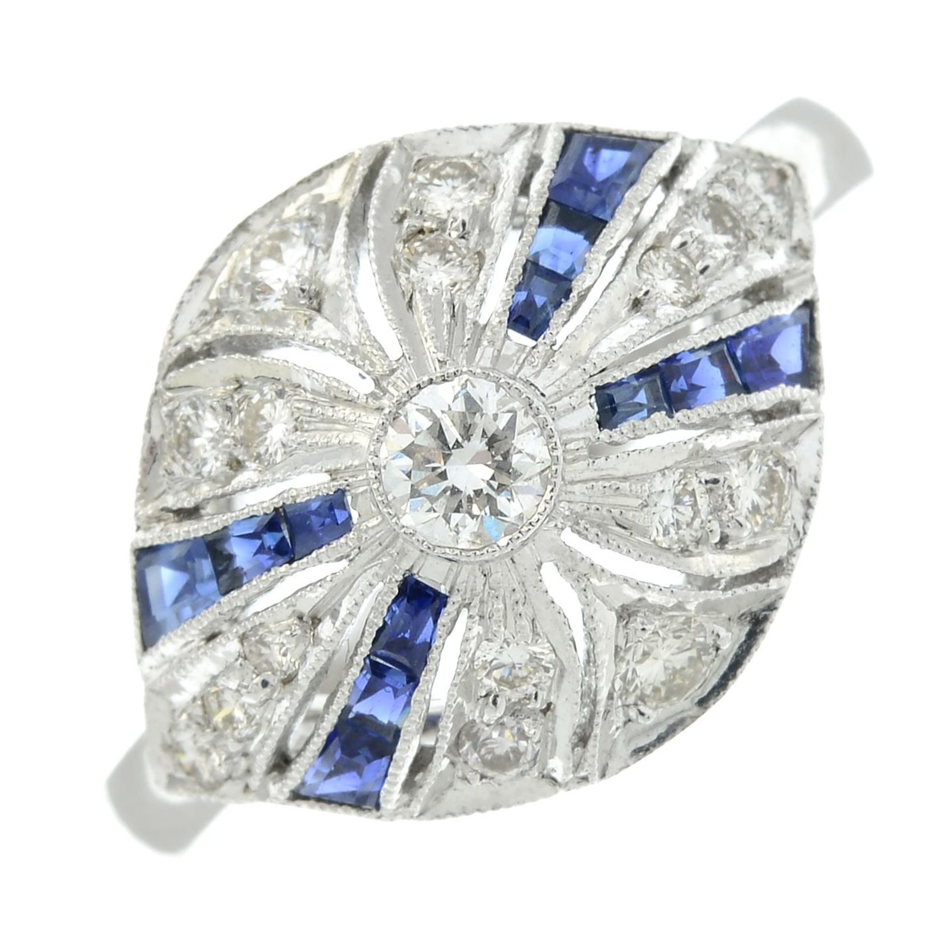 A brilliant-cut diamond and calibri-cut sapphire dress ring.Estimated total diamond weight