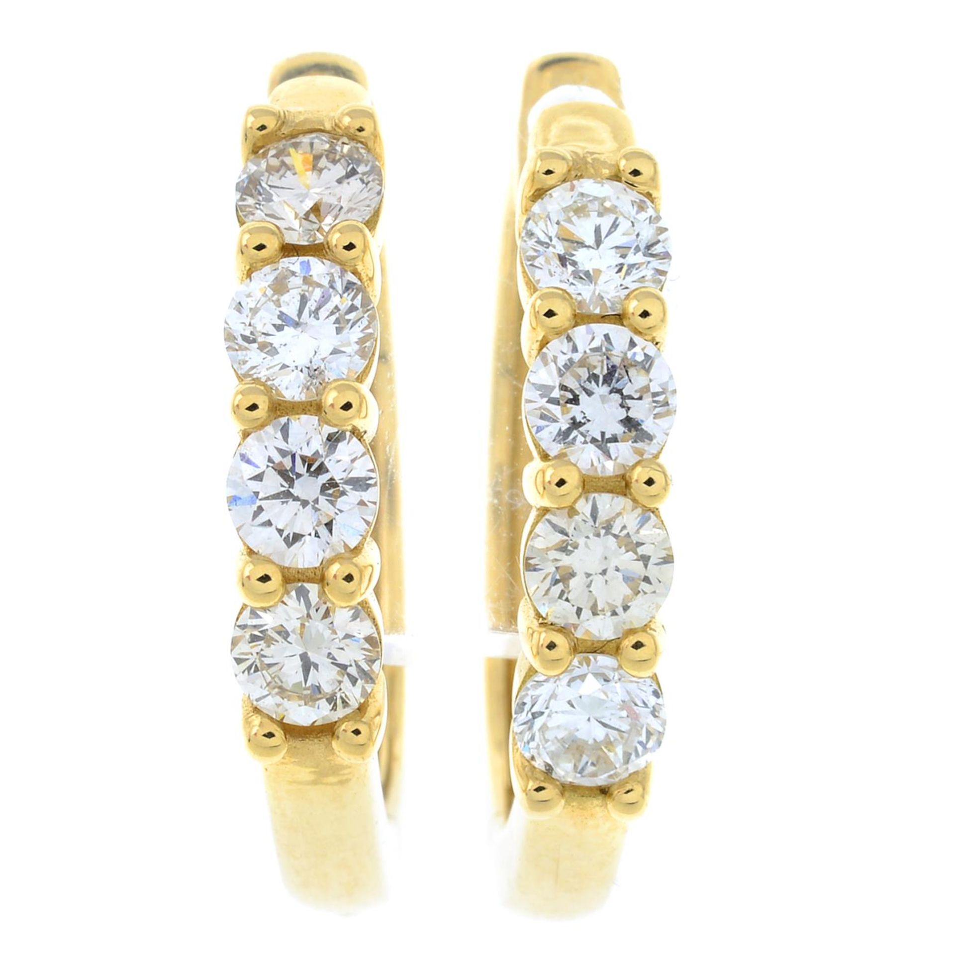 A pair of brilliant-cut diamond hoop earrings.Estimated total diamond weight 1.20cts,