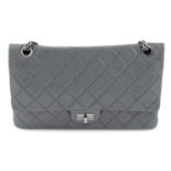 CHANEL - a grey leather 2.55 Reissue handbag.
