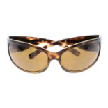 PRADA - a pair of brown sunglasses.