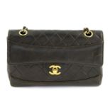 CHANEL - a vintage brown leather handbag.