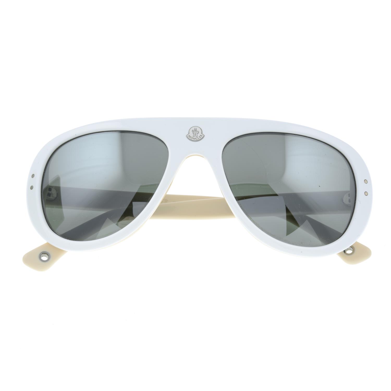 MONCLER - a pair of white sunglasses.