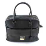 ANYA HINDMARCH - a black handbag with matching wallet.
