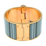 HERMÈS - a wide hinged enamel bangle.Signed Hermès.Inner diameter 6cms.