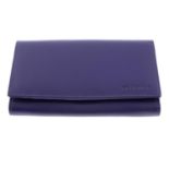 BRÜNHIDE - a purple leather purse.