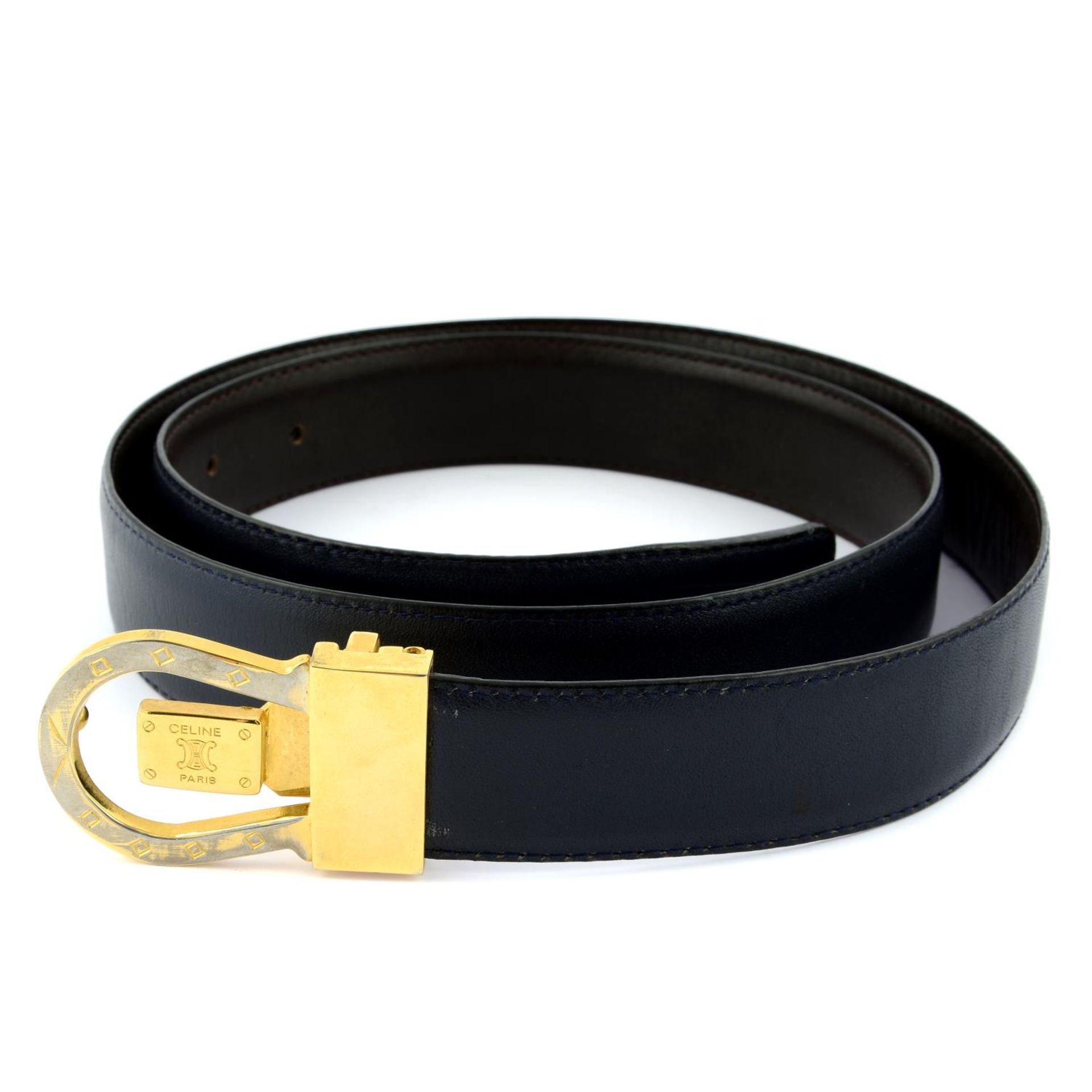 CÉLINE - a black leather belt.