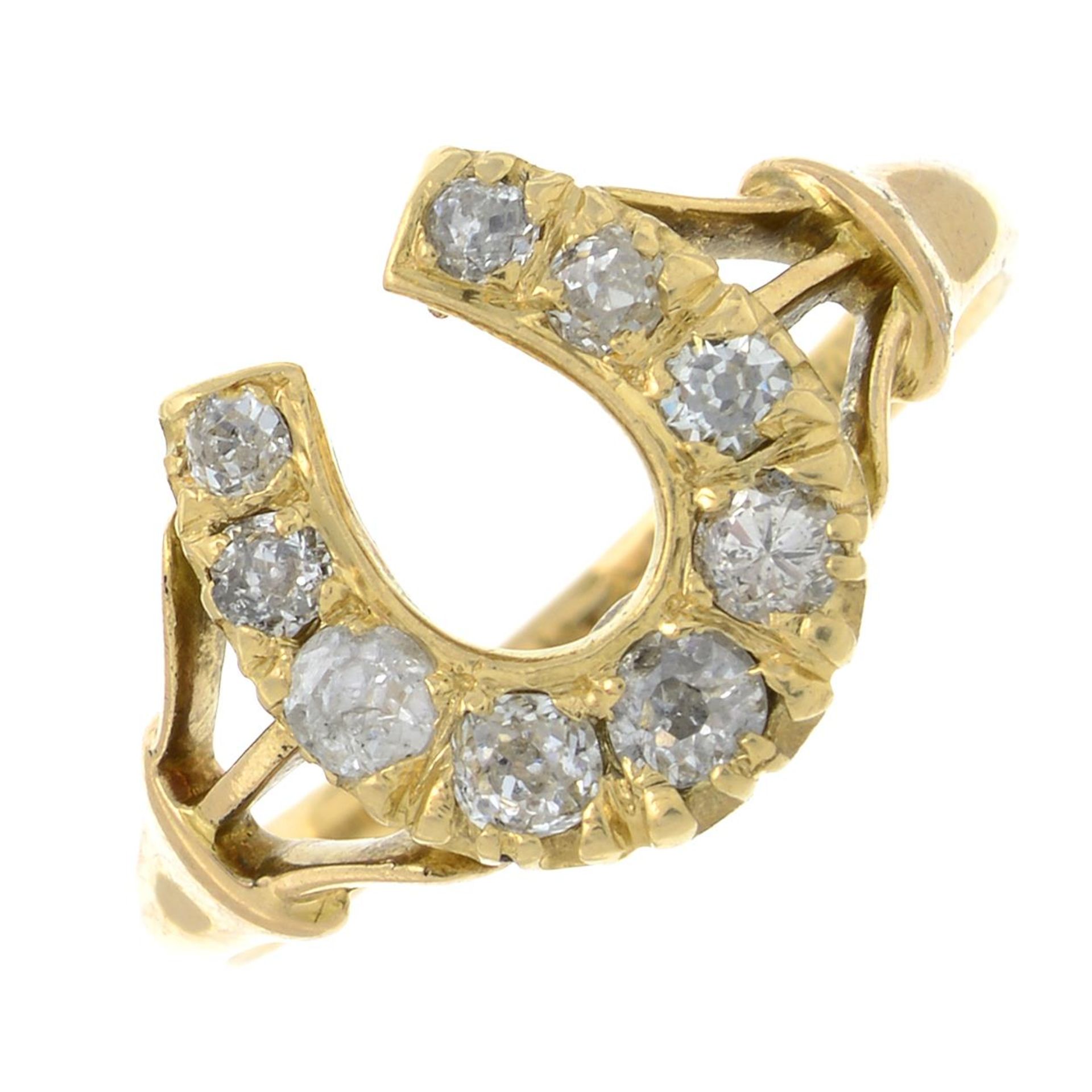 An old-cut diamond horseshoe dress ring.Estimated total diamond weight 0.30ct.