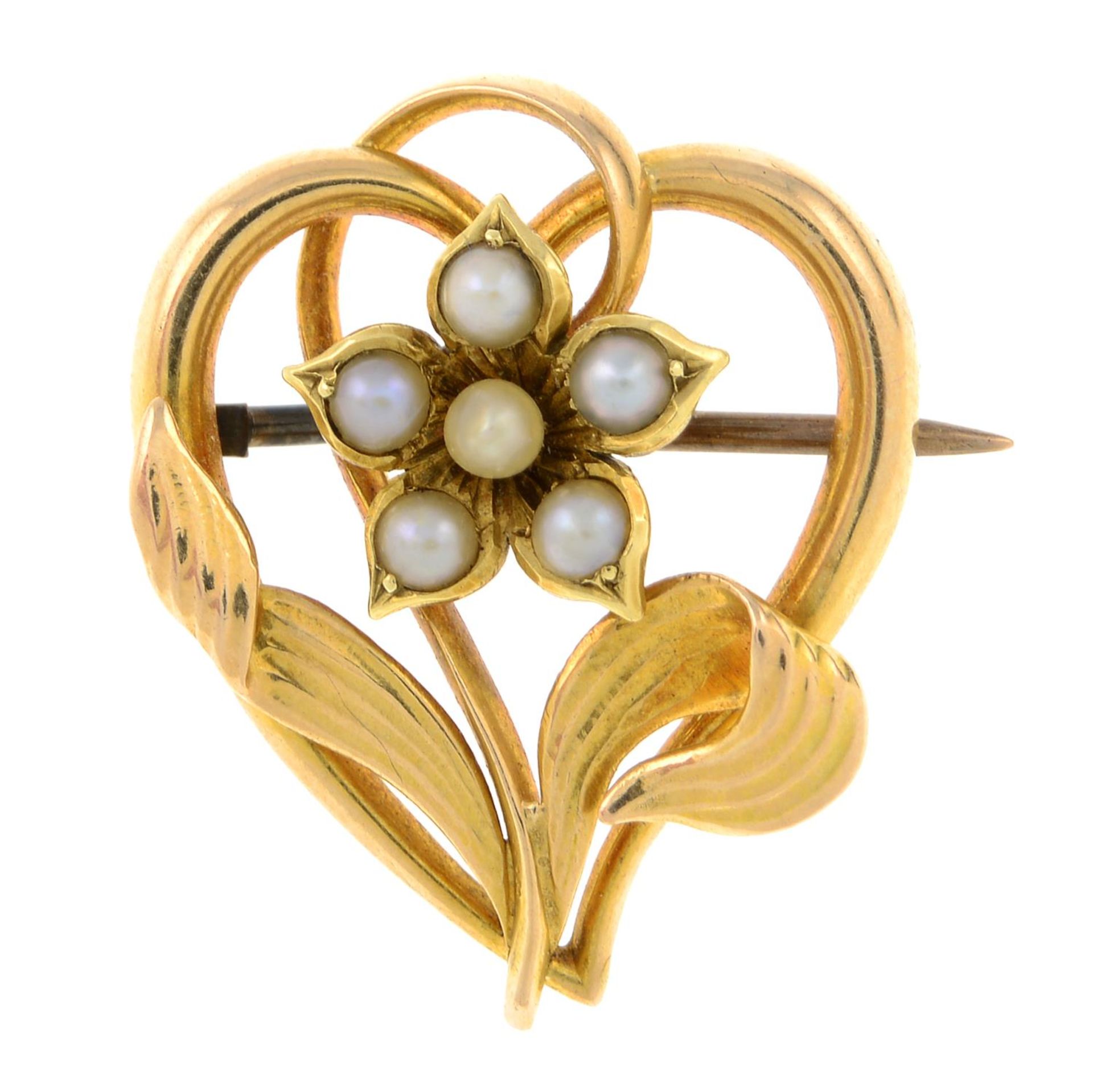 An early 20th century 15ct gold split pearl heart and flower brooch.May be worn as a