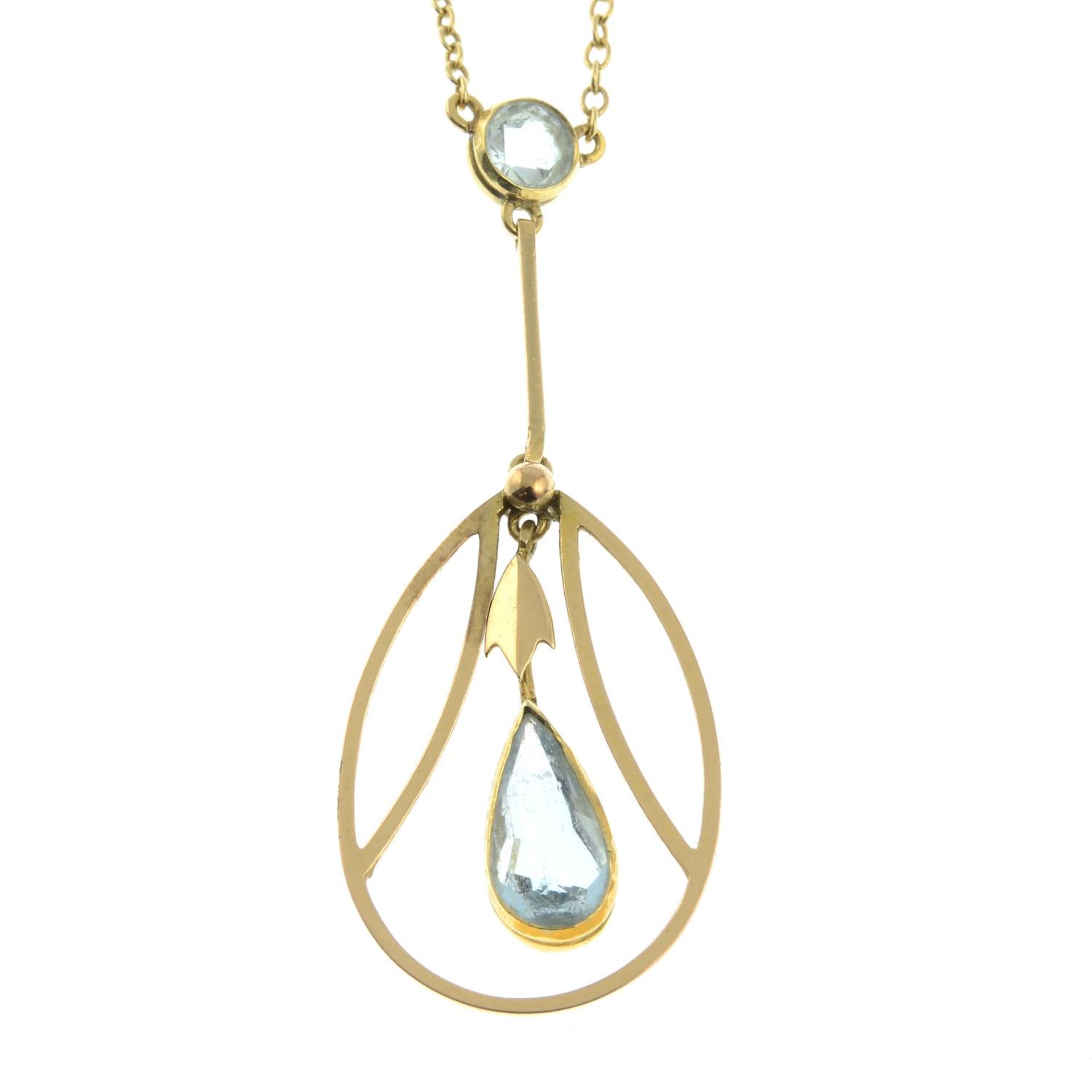 An early 20th century gold aquamarine pendant, on an integral chain.Clasp stamped 15CT.