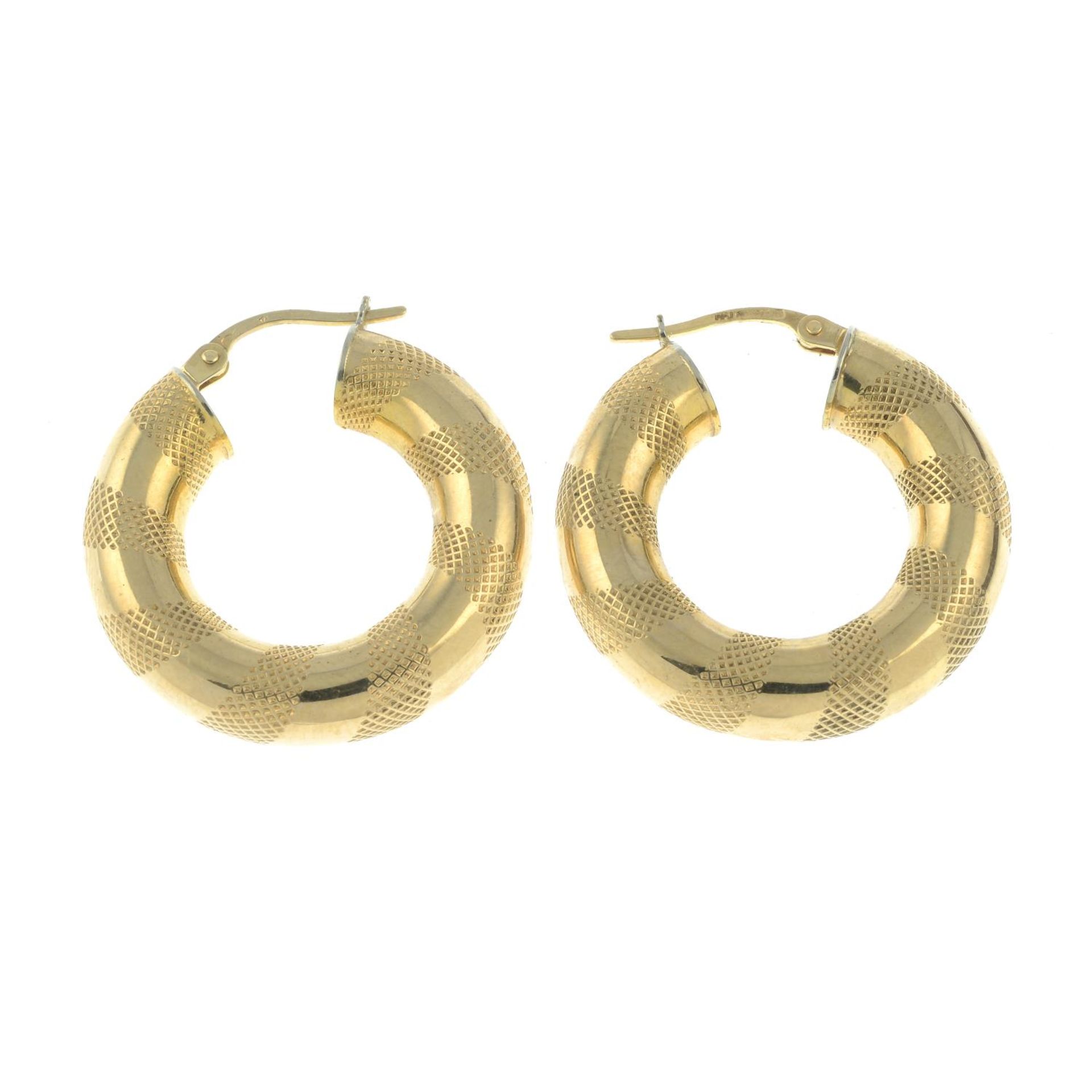 A pair of 18ct gold textured hoop earrings.Impost marks for Sheffield.Length 2.7cms.