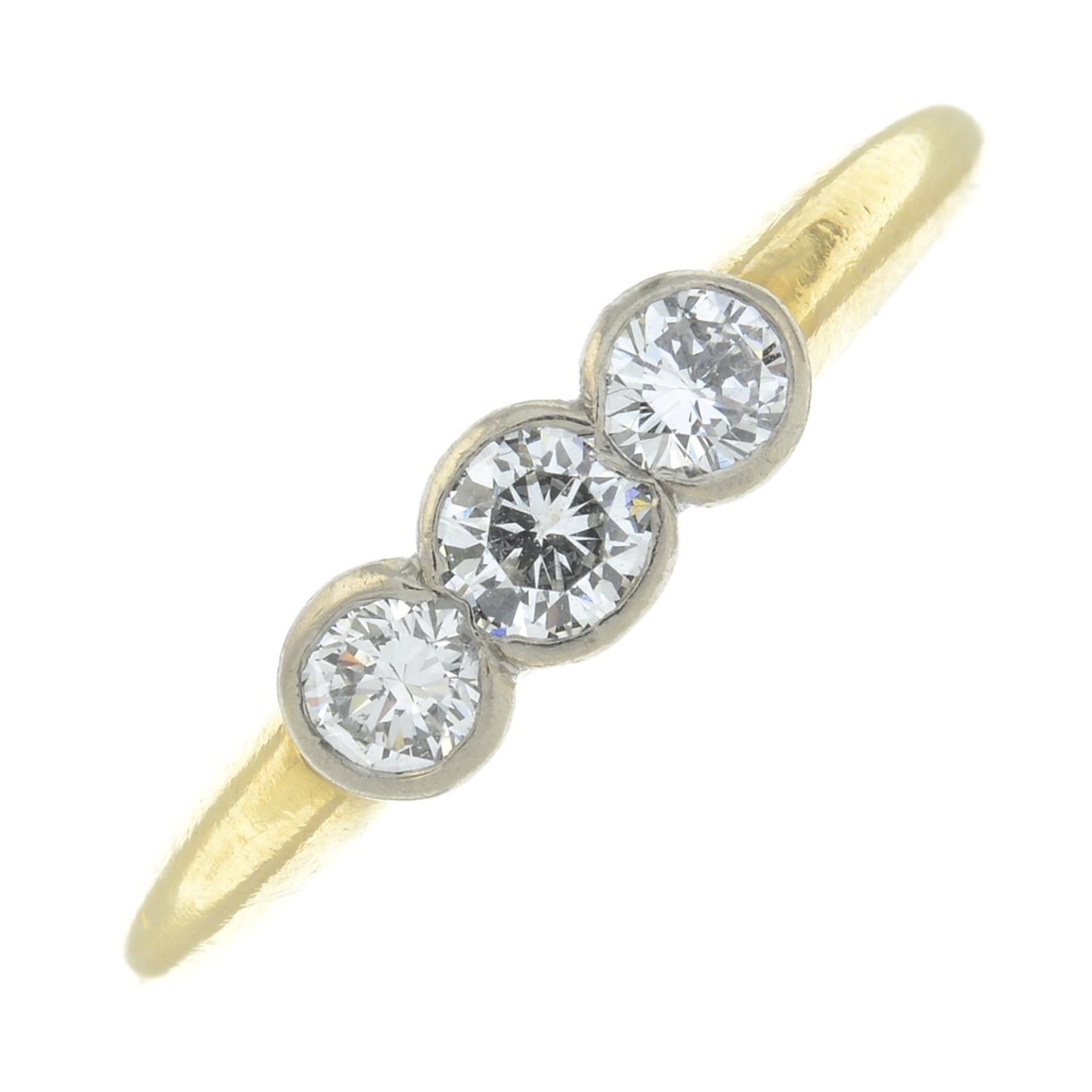 An 18ct gold brilliant-cut diamond three-stone ring.Estimated total diamond weight 0.50ct,