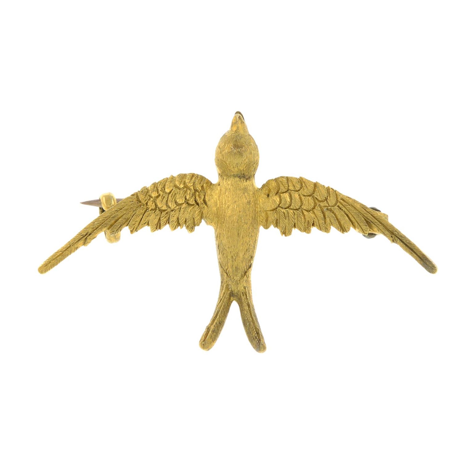 An early 20th century 15ct gold swallow brooch.Length 3.8cms.