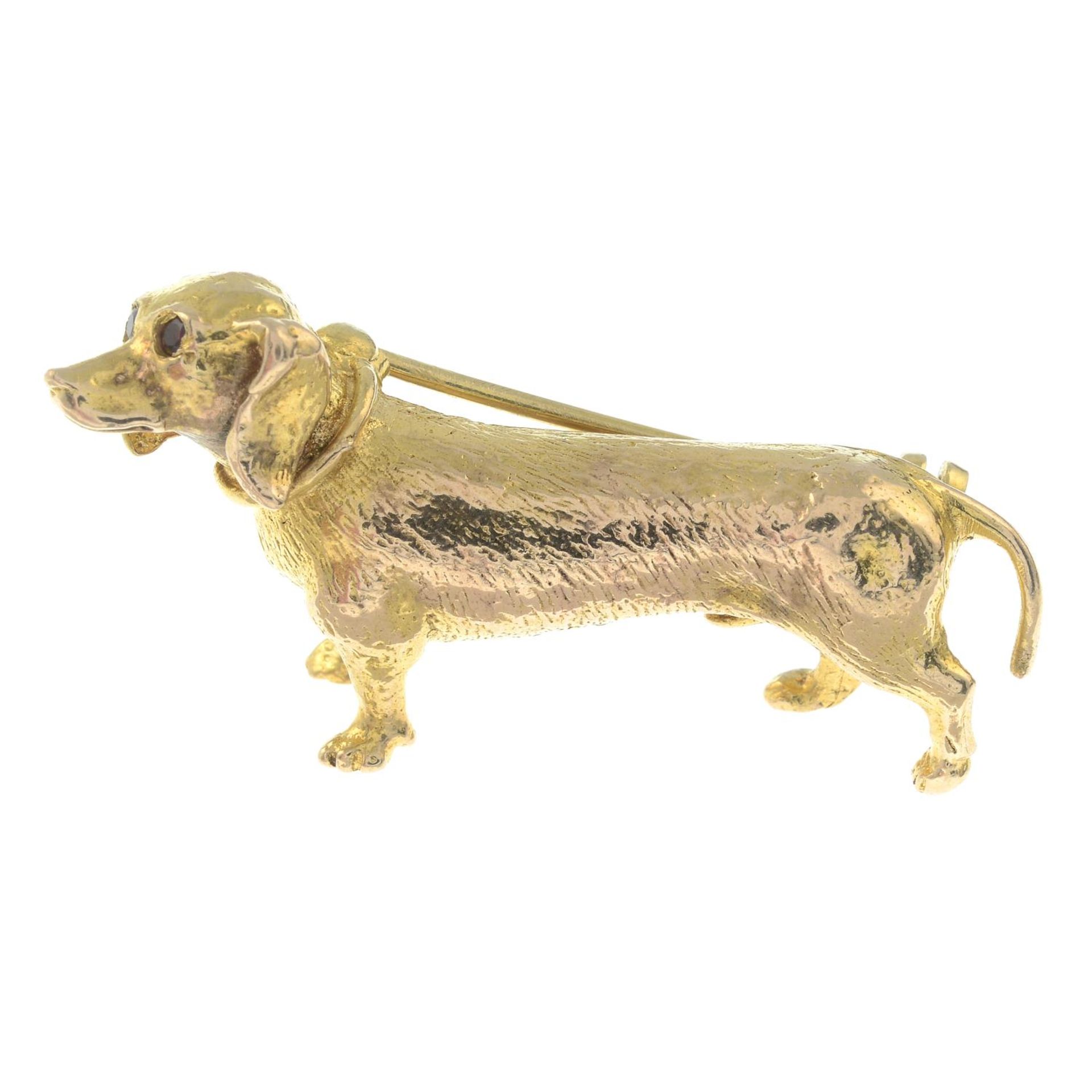 A 1960s 9ct gold dog brooch, with garnet eyes.Hallmarks for London, 1966.