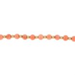 A coral bead bracelet.