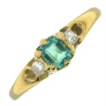 An early 20th century 18ct gold emerald and old-cut diamond three-stone ring.