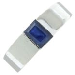 A sapphire single-stone band ring.