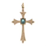 A synthetic spinel cross pendant.