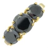 A 9ct gold black diamond three-stone ring.