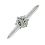 A brilliant-cut diamond single-stone ring.